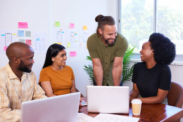 istock Team lead, manager, product owner - leads meeting, creative coding scrum team 1492923363