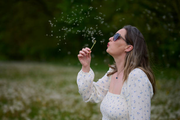 istock Blowing seeds of dandelion 1492923651