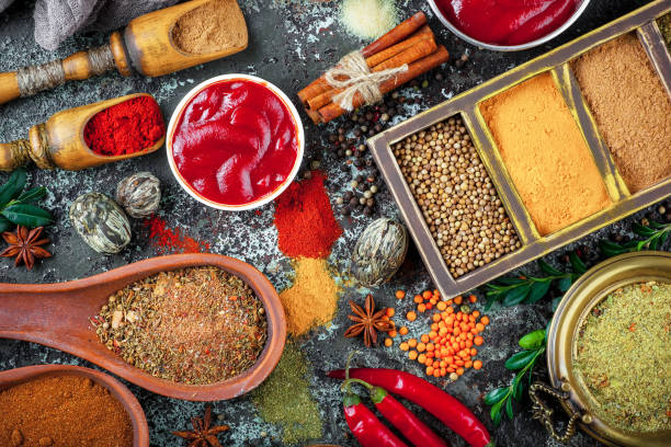 istock Spices and seasoning on old background. 1492924112