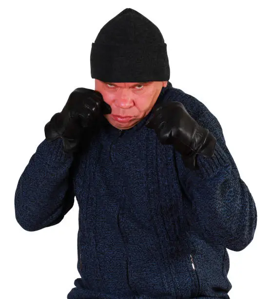 A tough, angry, aggressive and violent adult man clenches fists. He's ready to fight. Half-length portrait. Isolation on white background