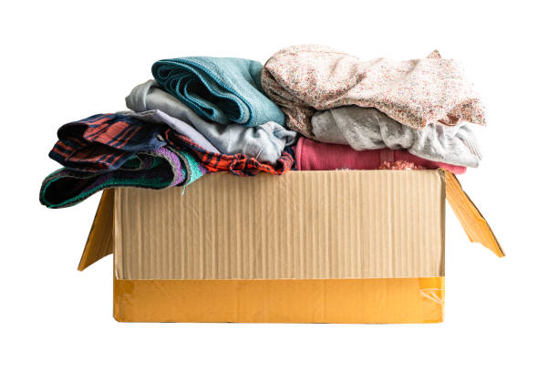 istock Donation box with used clothes isolated on white background with clipping path to support help for poor people in the world. 1492927151