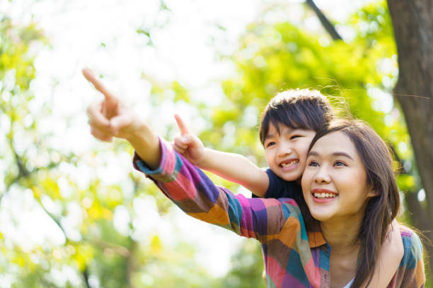 istock Boy and mon playing in the park. 1492927437
