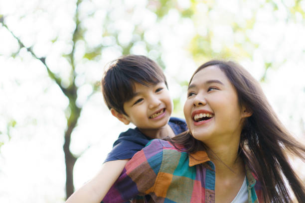 istock Boy and mon playing in the park. 1492927441