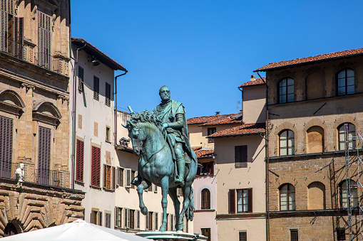 Turin, Italy – August 2023 – View of Piazza San Carlo, a central square renowned for its Baroque architecture, featuring the equestrian monument of Emmanuel Philibert in the foreground. The 1838 monument by Carlo Marochetti is situated at the center, surrounded by porticos designed by Carlo di Castellamonte around 1638.