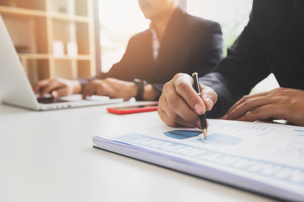 istock Businessman pointing monthly graph chart in meeting room. Data analyzing to find out the result. Business strategy concept. 1492929361
