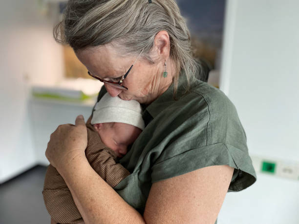 istock Grandparent with her just born grandchild 1492929981
