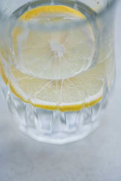 istock Pour water to slice lemon in glass to make lemonade 1492930186