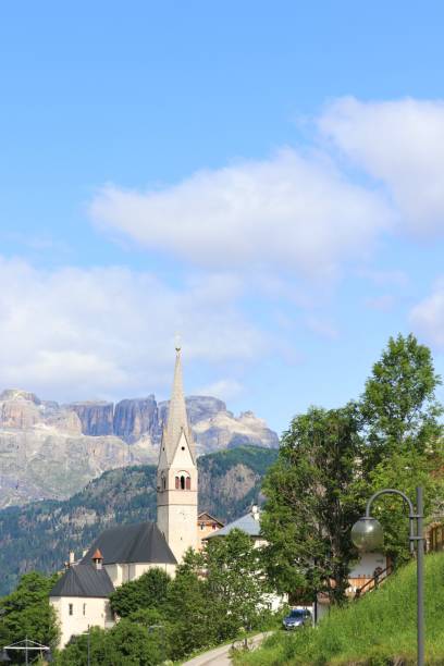 istock Large white clock tower on the hill of a mountain town 1492931653