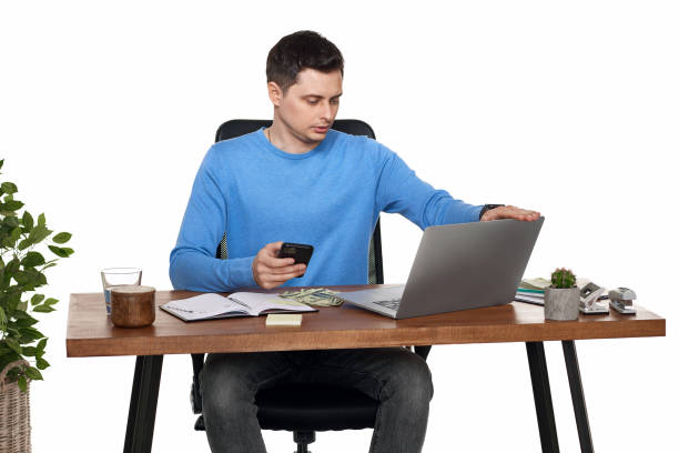 istock businessman working with laptop and using smartphone 1492932369