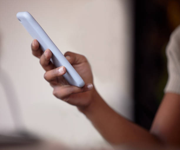 istock Woman, hands and typing on smartphone for connection, social media post and reading notification. Closeup female with mobile app, technology and search internet on website, digital network or contact 1492933706