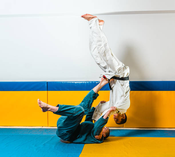 istock Brazilian jiu-jitsu and grappling training for men in a self-defense gym 1492936968