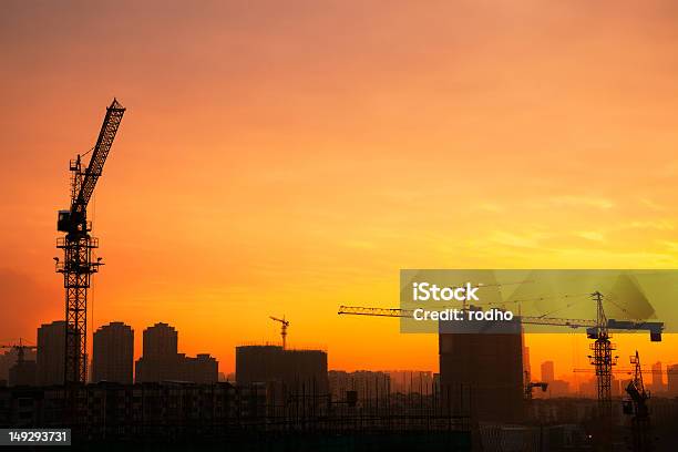 Silhouette Of Tower Cranes On The Construction Site Stock Photo - Download Image Now