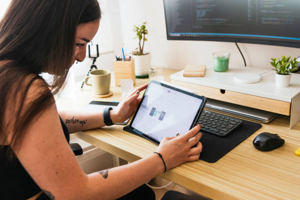 istock Computer Programmer Woman. Digital Diva: Tech-savvy Woman Thriving in Telecommuting as a Programmer 1492937355