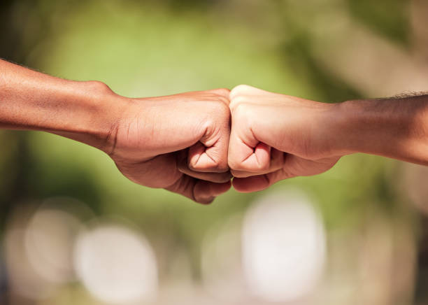 istock Fist bump, hands and teamwork, support or collaboration for team building, solidarity or unity. Hand connection, partnership or greeting, thank you or motivation for success, goal or targets outdoors 1492939057