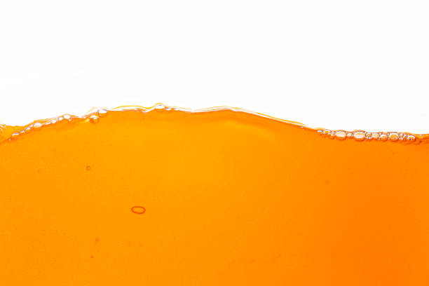 istock Orange juice isolated white background,orange juice texture on white background,Close up bright orange juice texture for health and nature waves 1492939241