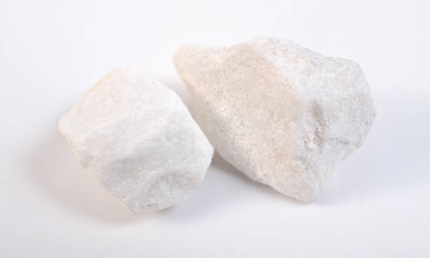istock Dolomite mineral stones heep on white background. 1492939270
