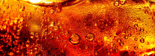 istock macro cola background,Cola and Ice, food background, Cola close-up, design element. Beer. Macro bubbles, ice, bubbles, background, ice cubes, abstract background. 1492939337