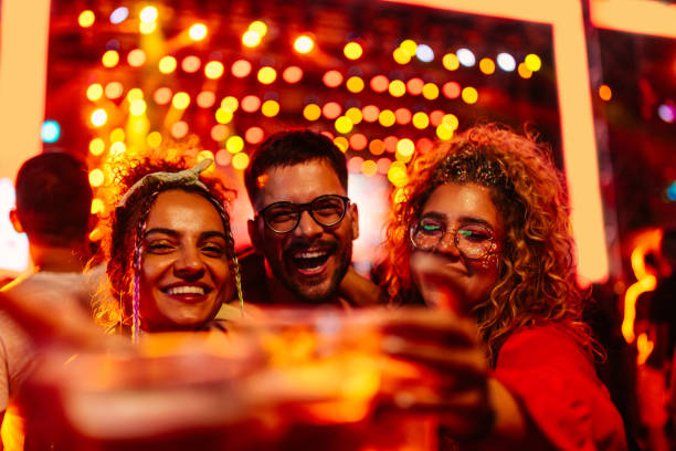 istock Three friends at music festival. 1492940027