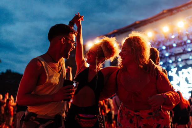 istock Friends having fun drinking beer and dancing at concert 1492941154