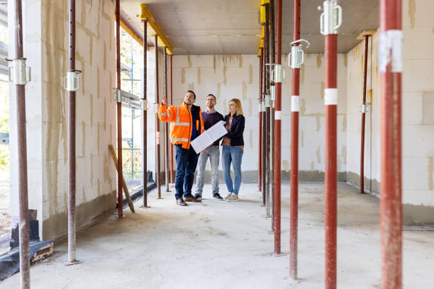 istock Architect discussing residential construction plans with new customers 1492941404