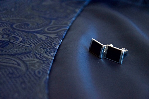 Cufflinks on blue damask suit, elegant tailored male dress, wedding minimal still life