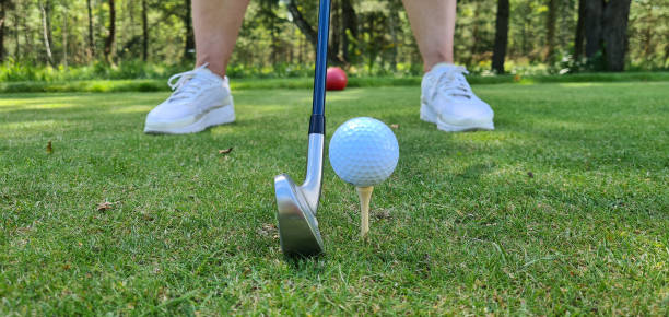 istock Closeup of golfer ready to tee off 1492943192