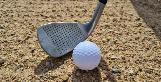istock Golf players hitting ball with sandblasting closeup 1492943204