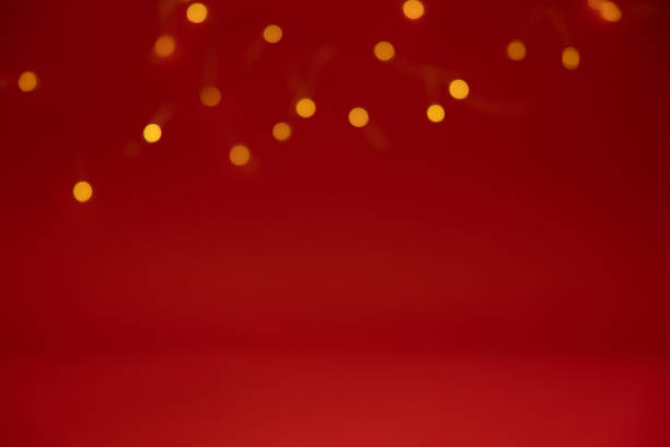 Mini lights border on a red background Bokeh mini lights as a border on a dark red background with copy space pentecost religious celebration photos stock pictures, royalty-free photos & images