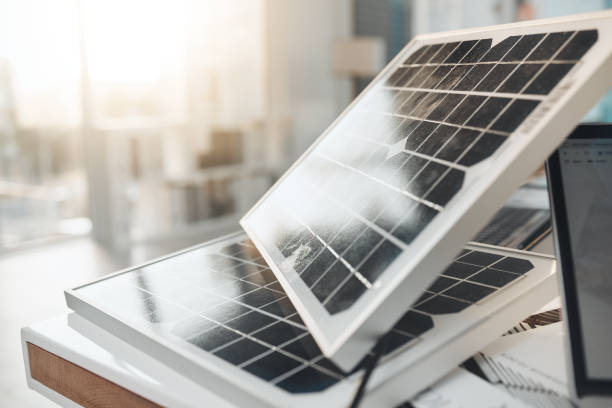istock Solar panel, office and design on desk for renewable energy, electricity tech or engineering innovation. Photovoltaic, eco friendly or sustainability for construction, goal or electric infrastructure 1492943697