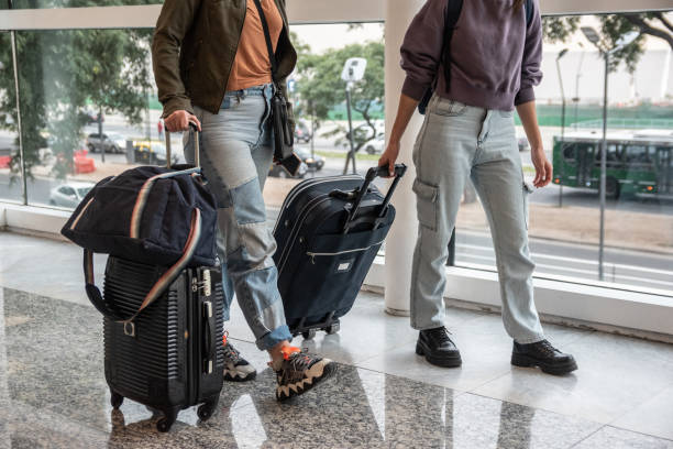 istock Low section of people walking on the airport 1492943790