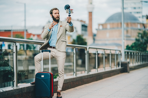 Businessman vlogging in the city