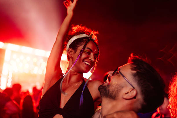 istock Cute couple at concert having fun 1492951197