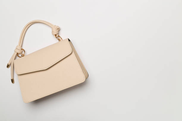 istock Fashionable leather bag on color background, top view 1492952857