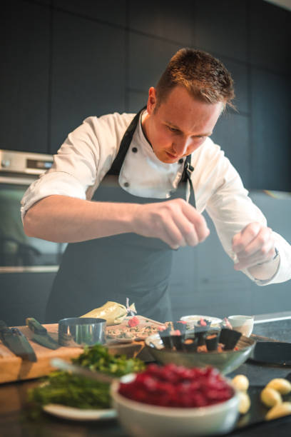 istock Expert Chef Crafting Gourmet Cuisine for Celebration 1492955709