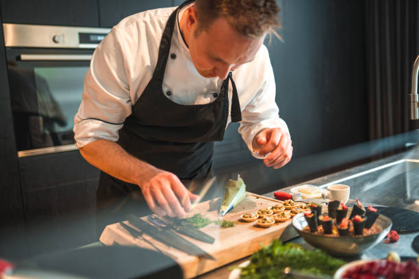 istock Caucasian Chef Cooking Memorable Dishes for Bachelorette Dinner 1492955711