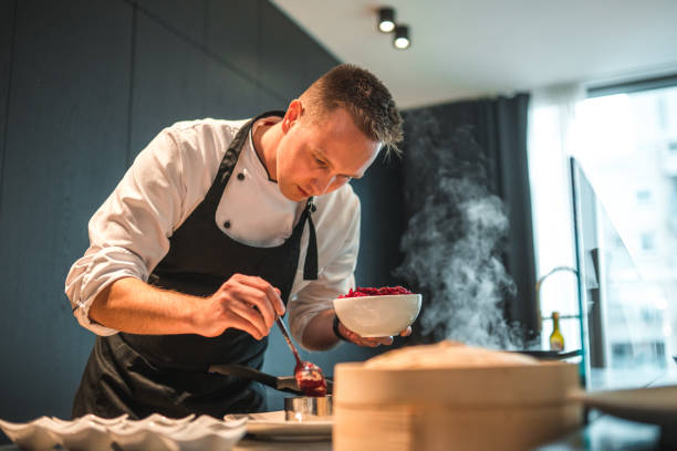 istock Creative and Dedicated Chef Preparing Gourmet Fare for Bachelorette Event 1492955769