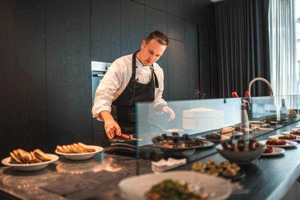 istock Talented Chef Cooking and Preparing Food for a Bachelorette Dinner 1492955854