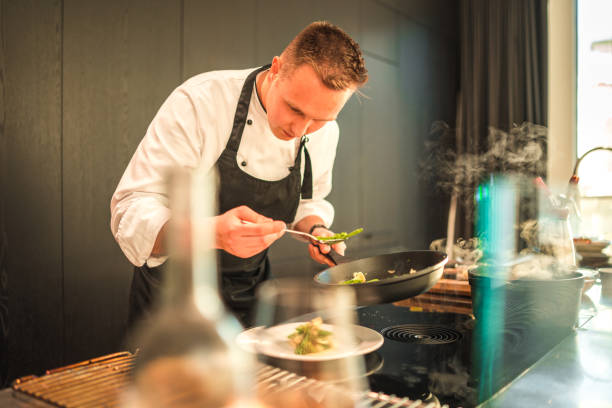 istock Young Chef Preparing Exquisite Delights for Bachelorette Dinner 1492955906
