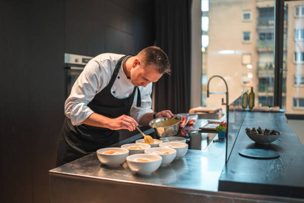istock Talented Chef Preparing Modern Food Creations for Bachelorette Dinner 1492955918