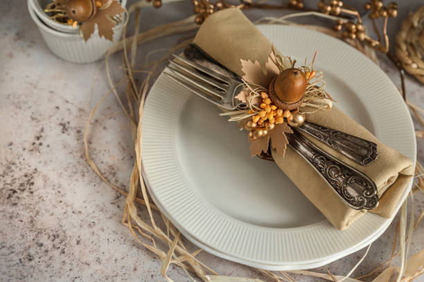istock Fall napkin decoration on a plate with acorns and leaves 1492957595