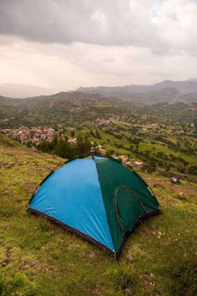 istock a green and blue tent set up in the field for camping 1492958413