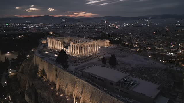 Aerial shots of the illuminated Acropolis of Athens, Greece at night
