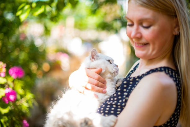 istock Young Woman and Her Beautiful Cat 1492960613
