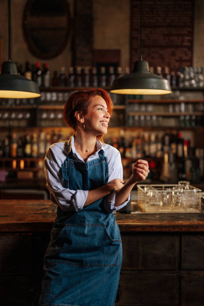 istock Portrait of happy Hispanic female bartender. 1492961002
