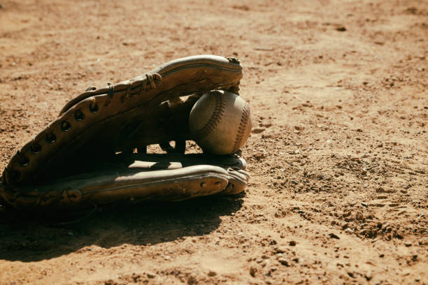 istock Baseball glove and ball on field 1492963909