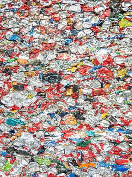 istock Crushed aluminium cans in a recycling plant. Pattern, background. 1492968125