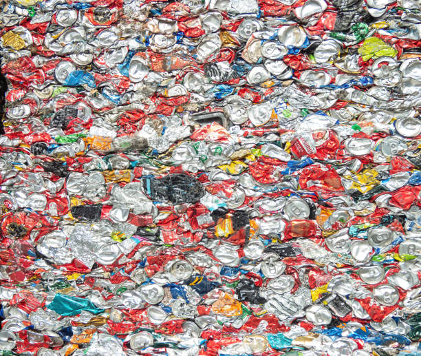 istock Crushed aluminium cans in a recycling plant. Pattern, background. 1492968129