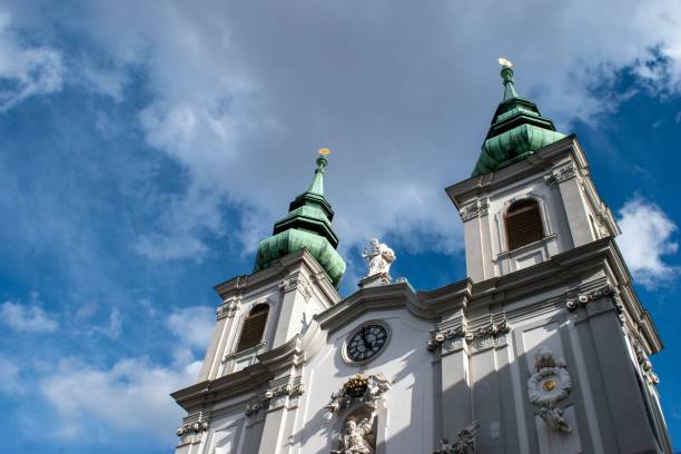 istock a large white building with two towers and two clocks on each side 1492972500