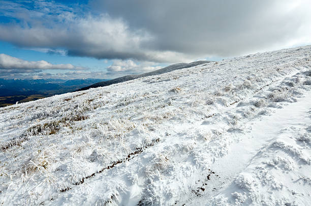 istock First winter snow on autumn  mountain plateau 149297640