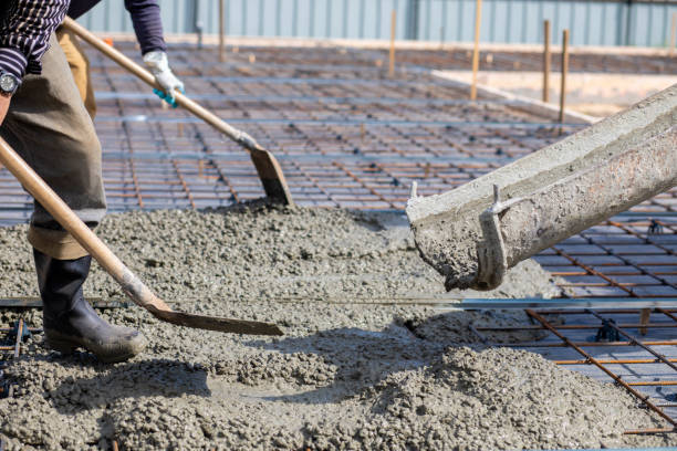 istock A worker spreads concrete with shovels over. 1492981116